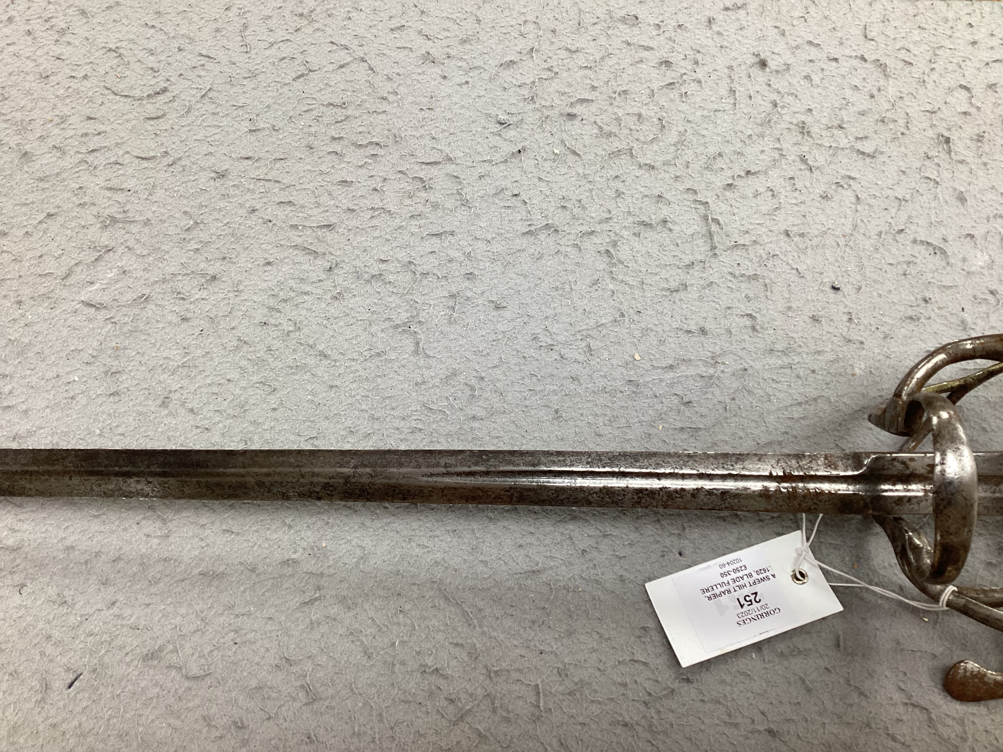 A swept hilt rapier, c.1620, blade fullered at the forte, iron guard of conventional form with later pommel and wooden grip, blade 113cm